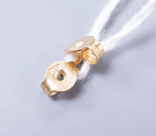 A modern pair of 18k yellow metal, cultured pearl and diamond cluster set drop earrings, 21mm, gross weight 4.3 grams.